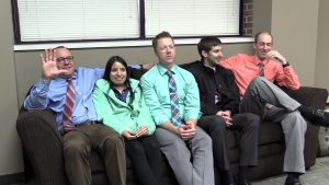 A group of people sitting on a couch